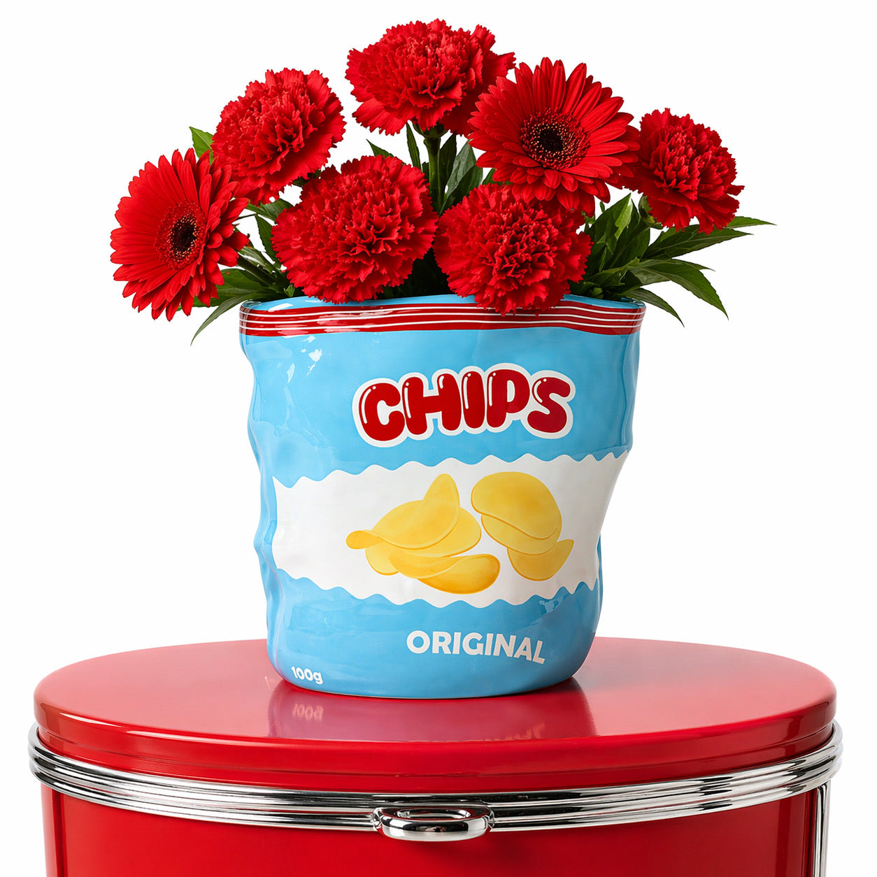Chips Vase with red blooms on a red diner stool